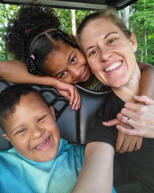 Sometimes parenting is relentless advocacy in classrooms, board meetings, medical offices, hospital hallways, and family gatherings.

Sometimes it's building courage and confidence in their identity when white kids won't respect the elemental adage, 'please keep your hands to yourself.'

Sometimes it's tossing the car keys into eager teen hands when the clock tries to convince me that efficiency matters more than opportunity.

Sometimes it's 
braiding hair and
dosing meds and
tucking sheets around wiggly bodies and
nudging sleepy heads to rise and
cleaning wounds and 
holding hands and 
telling stories and 
texting jokes and 
listening when their eyes fill and their lips quiver and their hearts break and
resisting the urge to reach for any elusive Band-aid and 
working through conflict and
praying and cursing and
begging for a damn break from all the hard and then

gently turning their gaze toward the kids across town 
and across oceans who are desperate to be seen--
--to live--and
finding some way to show up with Hope
even as we stumble along with Jesus.

All the while trying to tend to my own needs and wounds and work and dreams.

And sometimes 
it's a simple golf cart ride through the woods at dusk, 
rocking out to Beyonce and Noah Kahan on repeat,
grateful for the enduring Love 
who holds us through the mess of it all.

[ID: White mom with brown hair is sitting on a golf cart with her Brown girl with black hair who sits behind her. The girl's arm is draped around her mom's neck. A Brown boy with short black hair is sitting in the front seat beside his mom. All 3 are smiling.]

#Parenthood #Grateful #Together #Motherhood